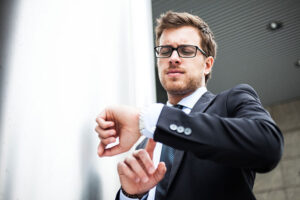 Businessman checking watch